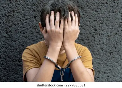 10yearold-boy-handcuffs-sits-on-260nw-2279885581